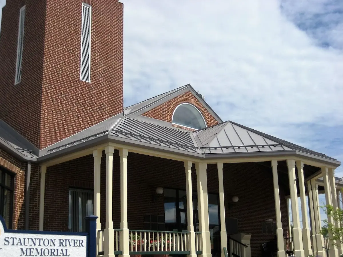 Skilled roofing craftsmen working on a residential roof in West Revere